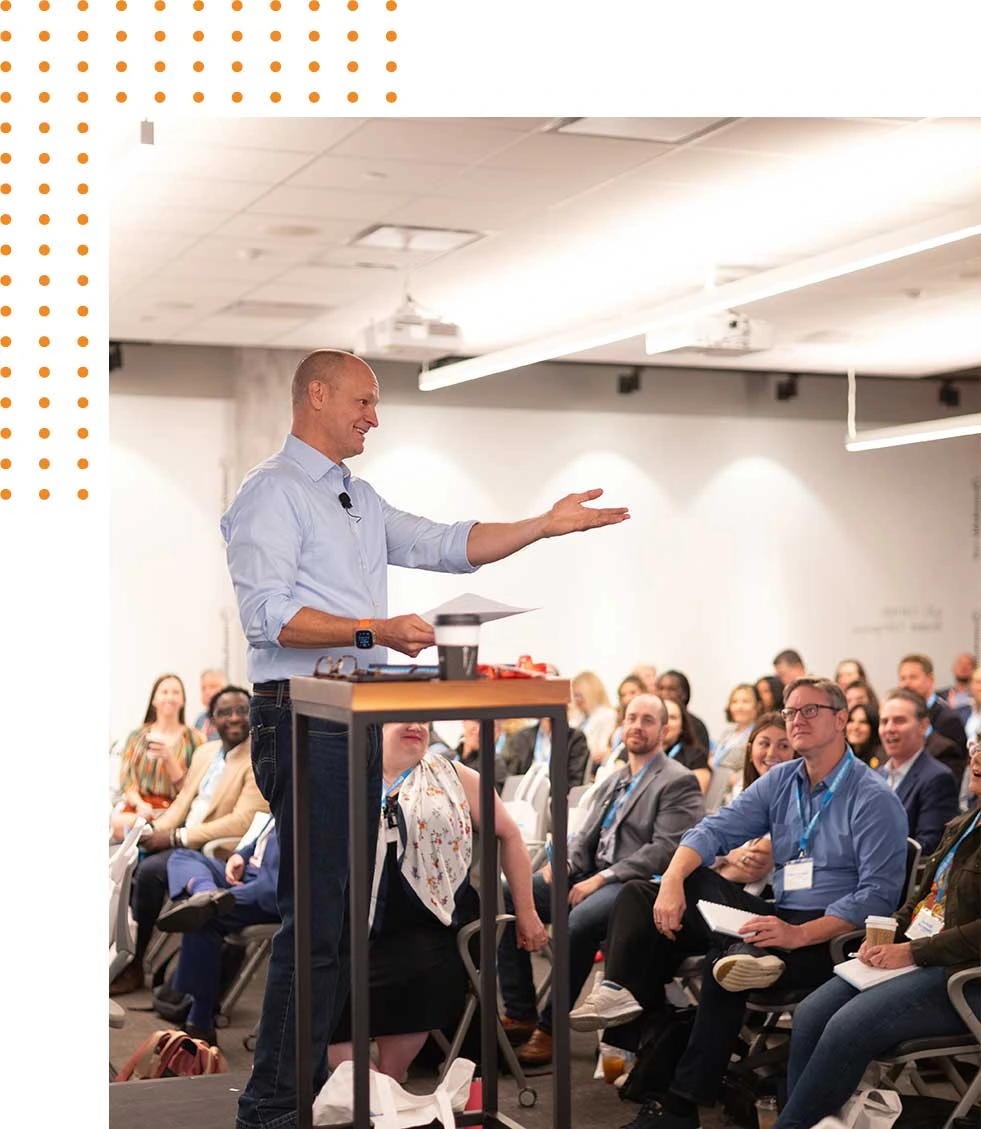 Mo Bunnell speaking to a full audience during a Bunnell Idea Group business development training session.